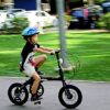 A kid is riding bike